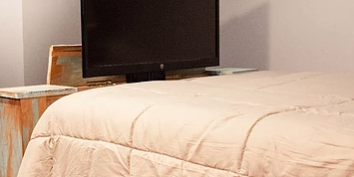 Screen Shot 2019-06-10 at 1.59.09 PM bottom and footbed of multi-colored wood tv lift bed