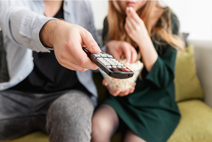 couple using a tv remote
