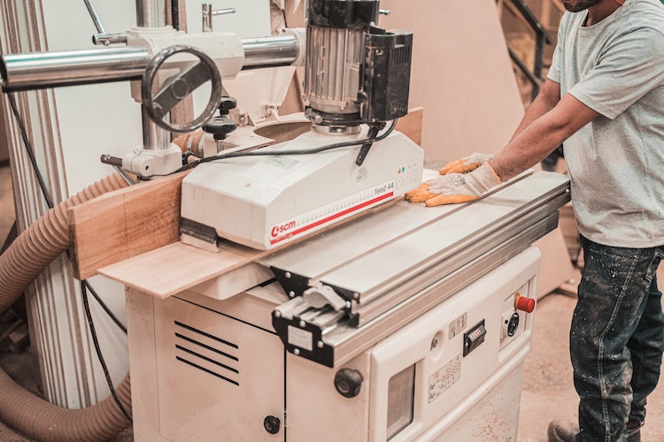 Man building a TV bed in wood shop