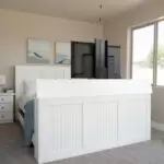 decorated white tv lift bed with tv