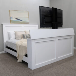 white decorated bed with tv coming out