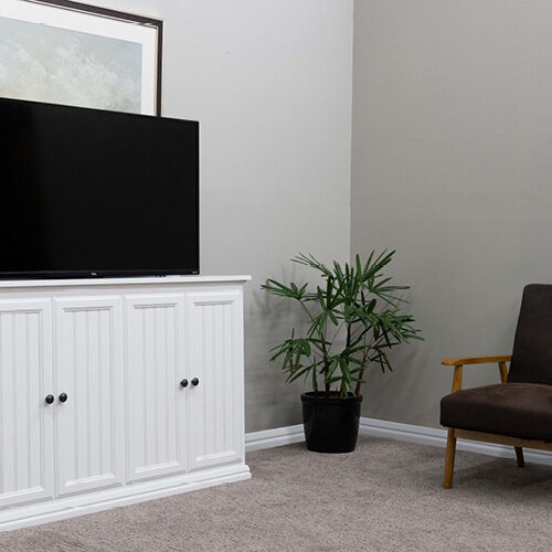 white cabinet with tv lifting out of it