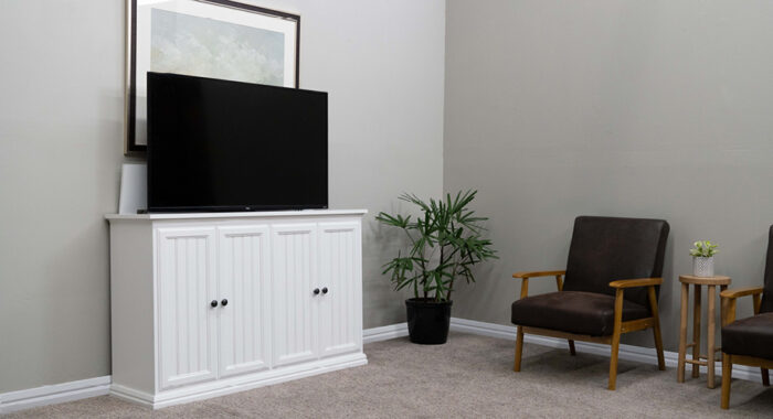 white cabinet with tv lifting out of it