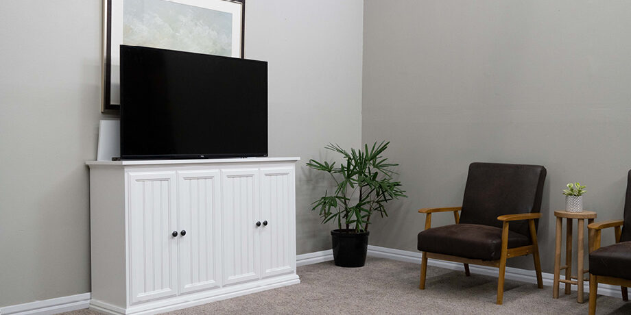 lindon lifestyle cropped white cabinet with tv lifting out of it