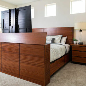 dark wood bed with tv lift in footbed