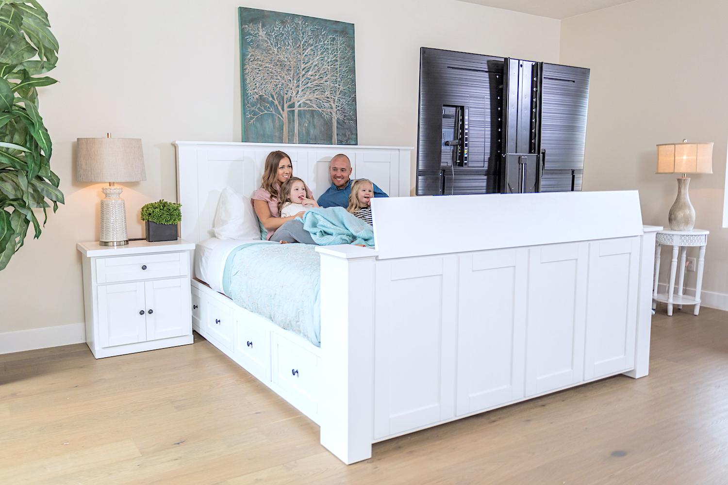 family in a TV bed