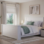 white bed with green and brown accents