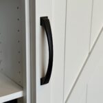 handle of white wood tv cabinet
