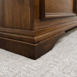 leg of dark wood bed