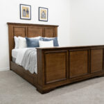 decorated dark wood bed