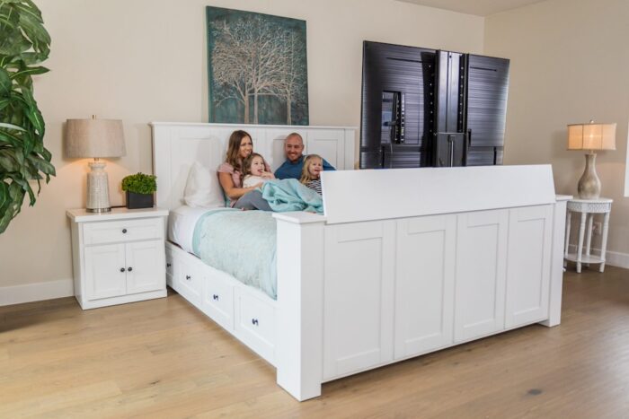 family in bed small Family watching tv in TV Lift Bed
