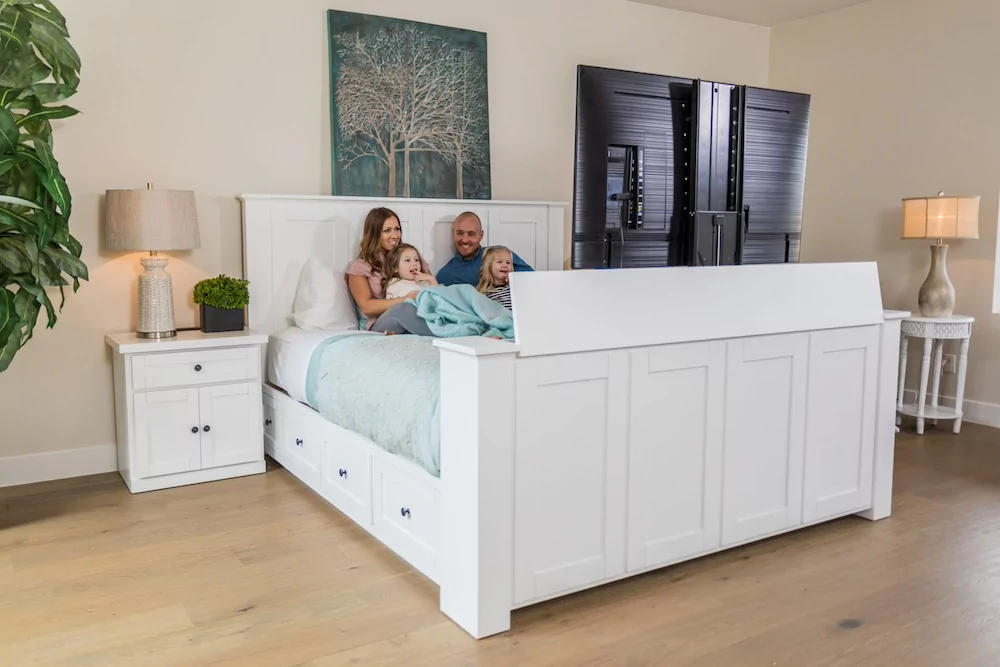 Family watching tv in TV Lift Bed