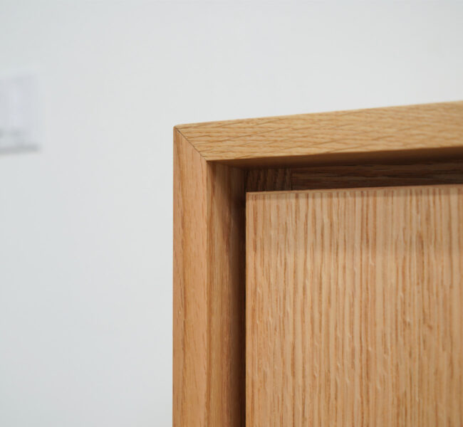 corner of wood tv lift cabinet